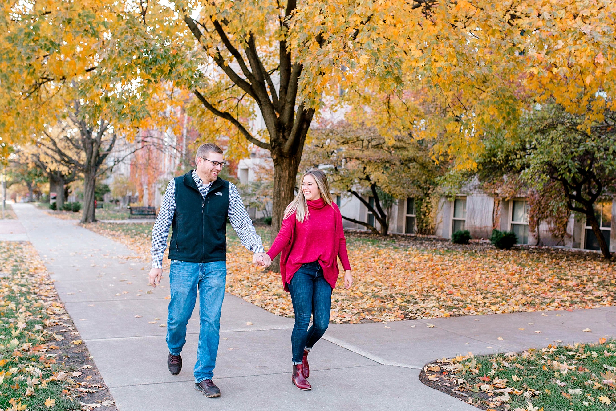 Couple holding hands and walking at Iowa State