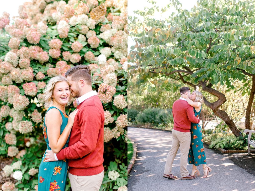 Engaged couple kissing in garden