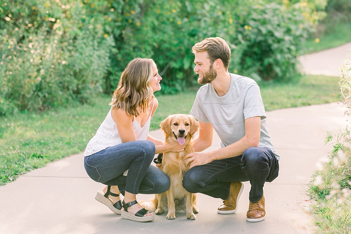 couple looking at each other with dog