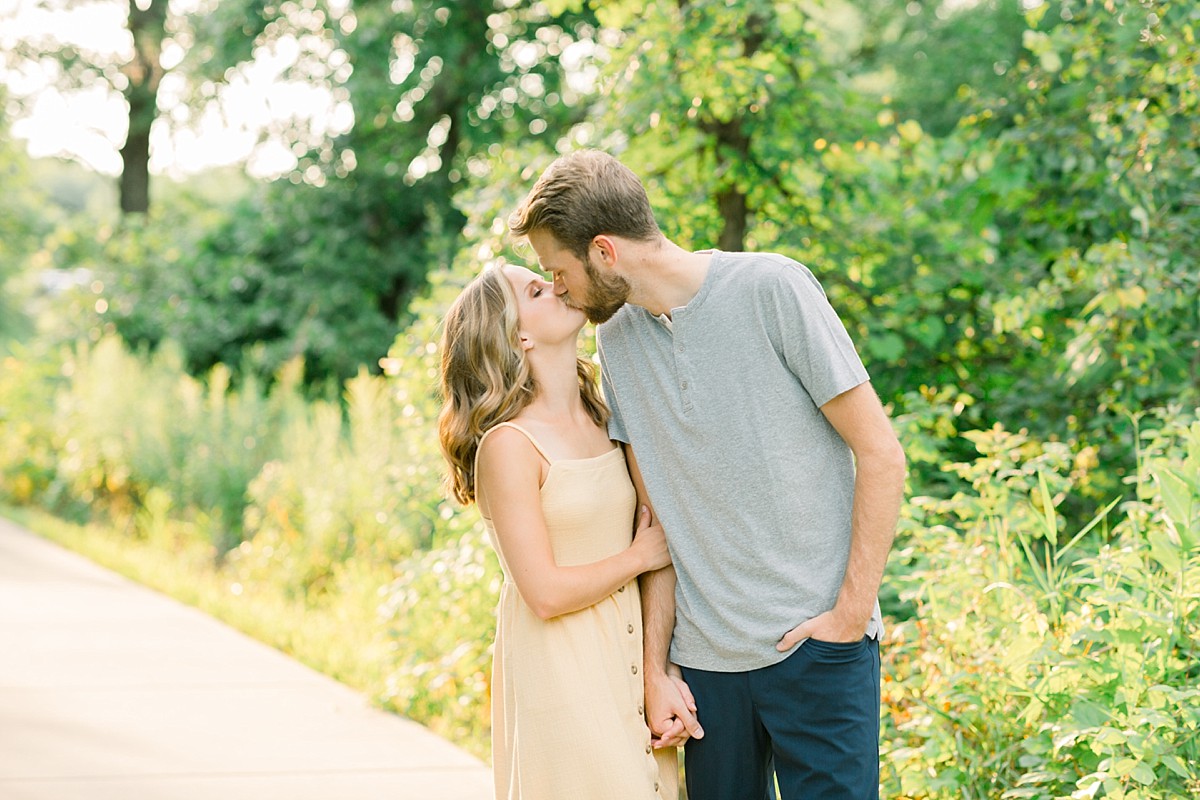 Couple kissing for engagement photo at Lebanon Hills