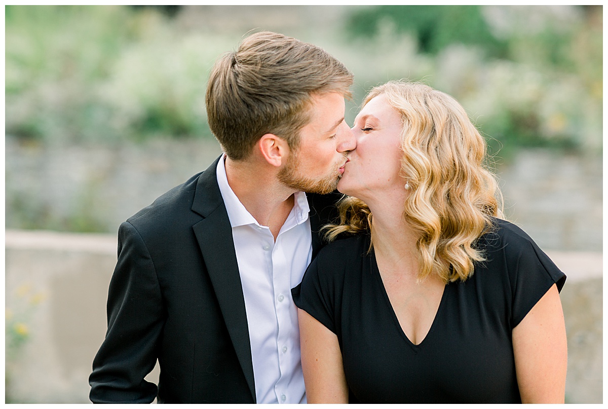 Couple kissing for engagement pictures
