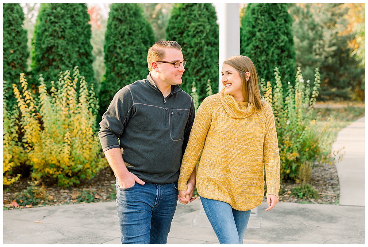couple holding hands for engagement photos