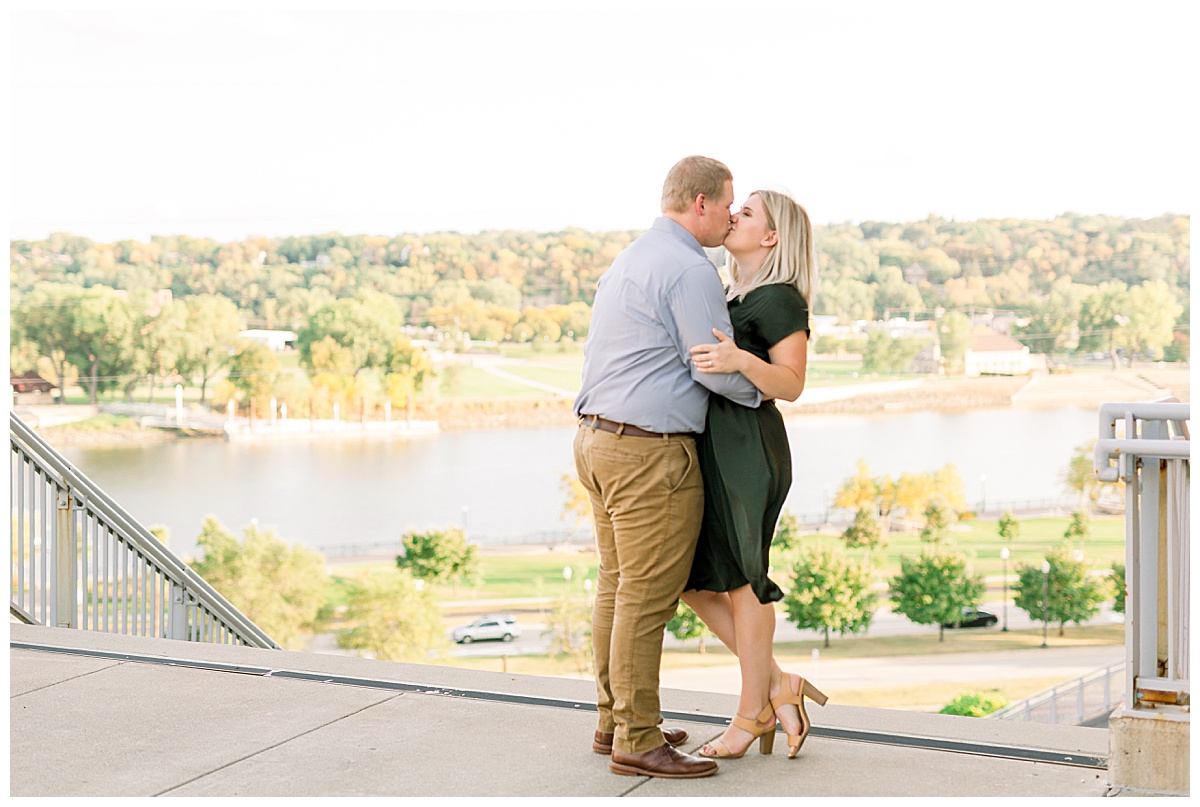 couple kissing in fall engagement photos