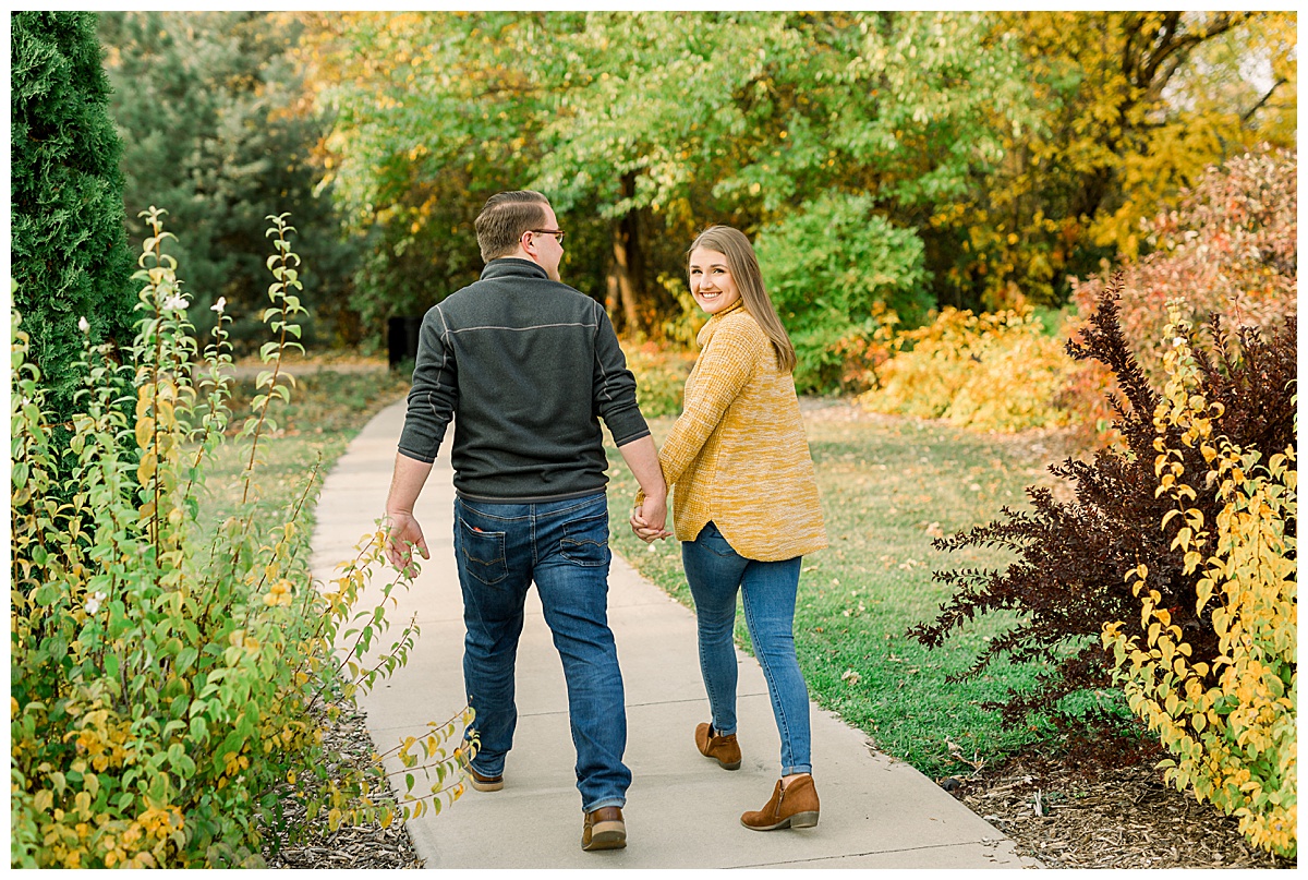 couple walking for engagement photos