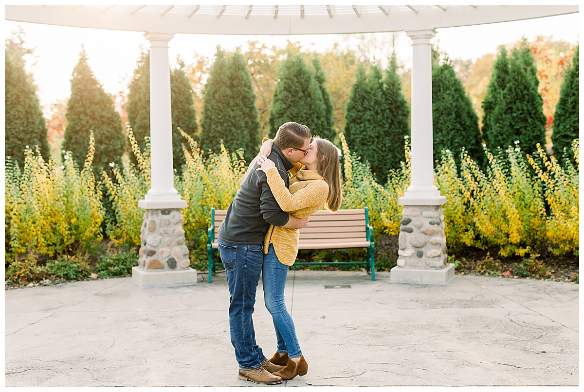 couple kissing at como park engagement photos