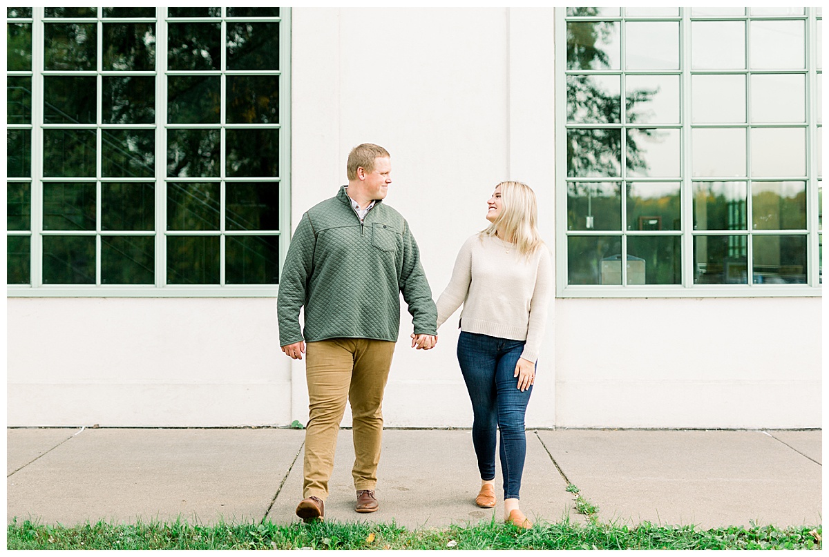 couple holding hands for engagement photos
