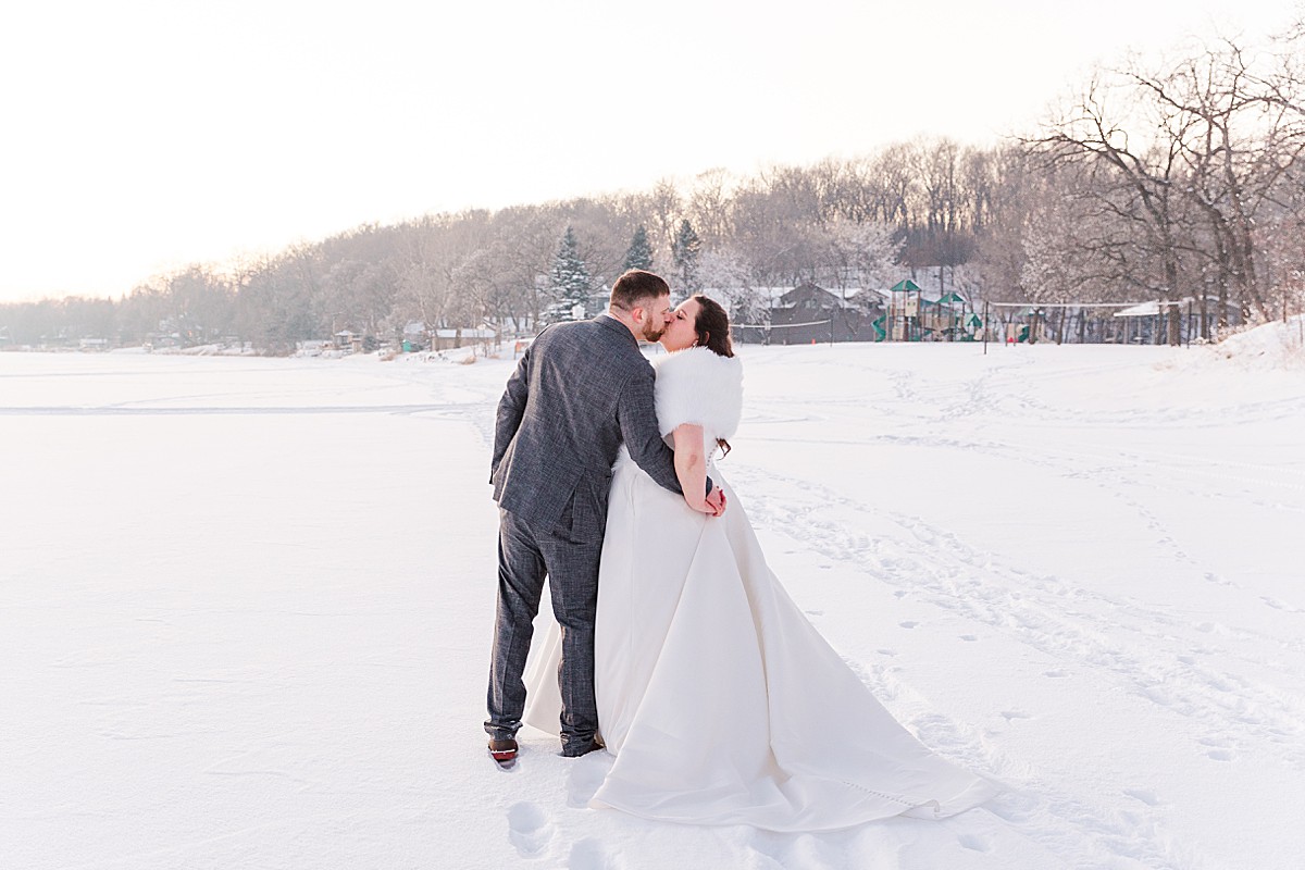 Bride and groom on Minnesota frozen lake