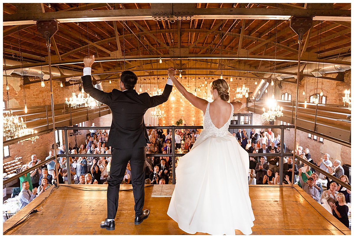 Couple cheering at reception