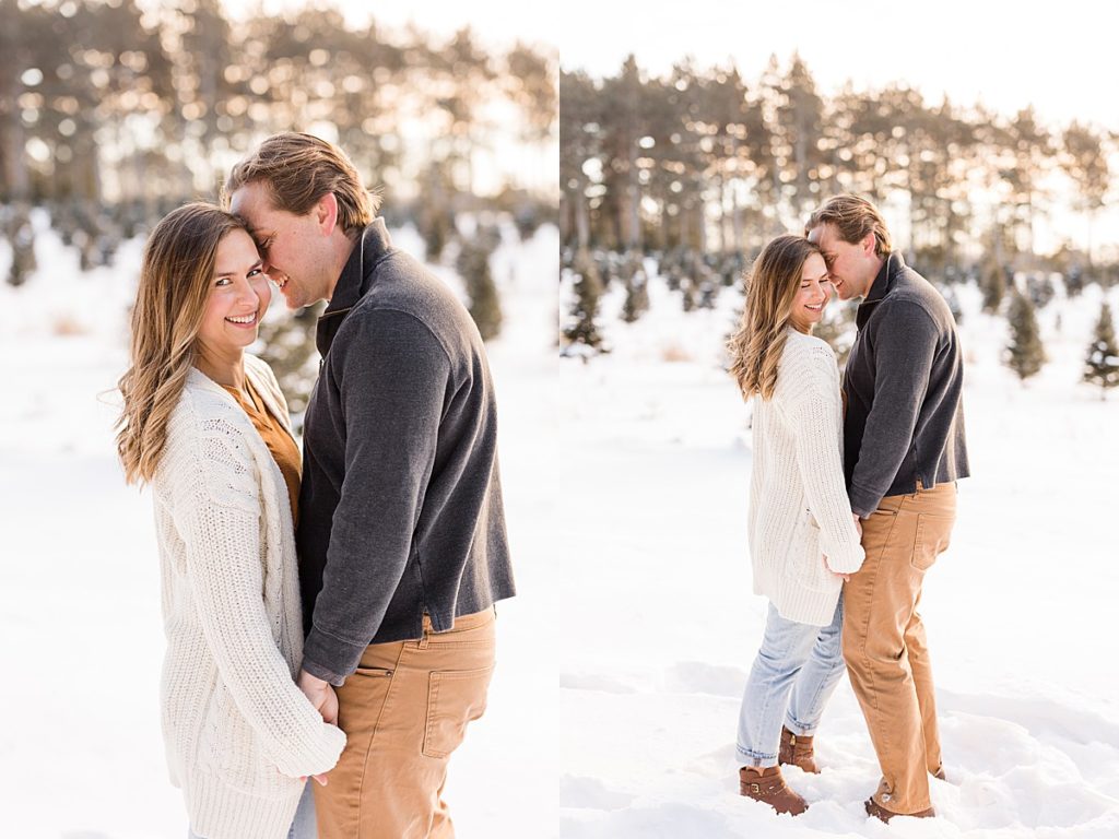 Couple standing in snow for winter engagement photos