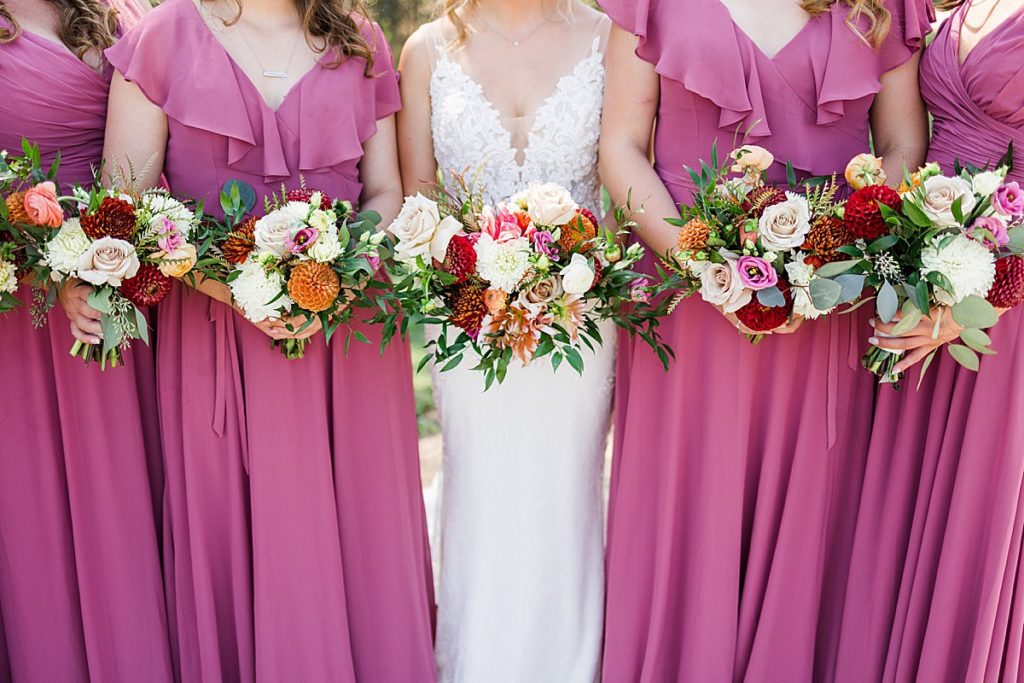 Bridesmaids with pink dresses and flowers